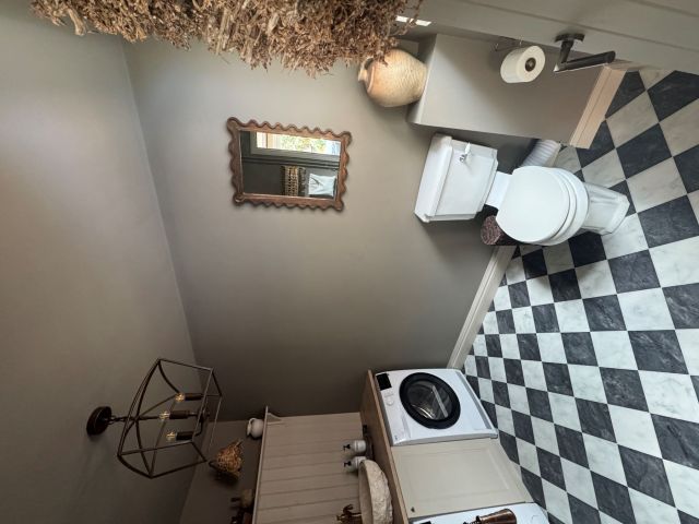traditional utility room with black and white checkerboard floor